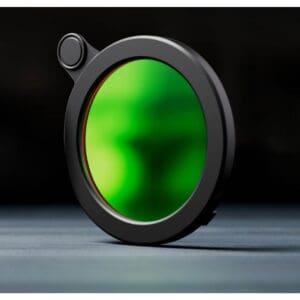 Black circular filter with green glass center.