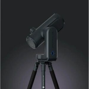 Dark telescope on a tripod stand.