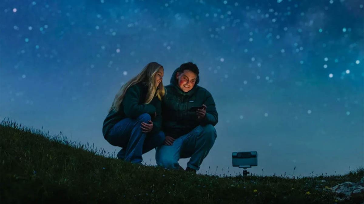 Couple enjoying a starry night outdoors together.